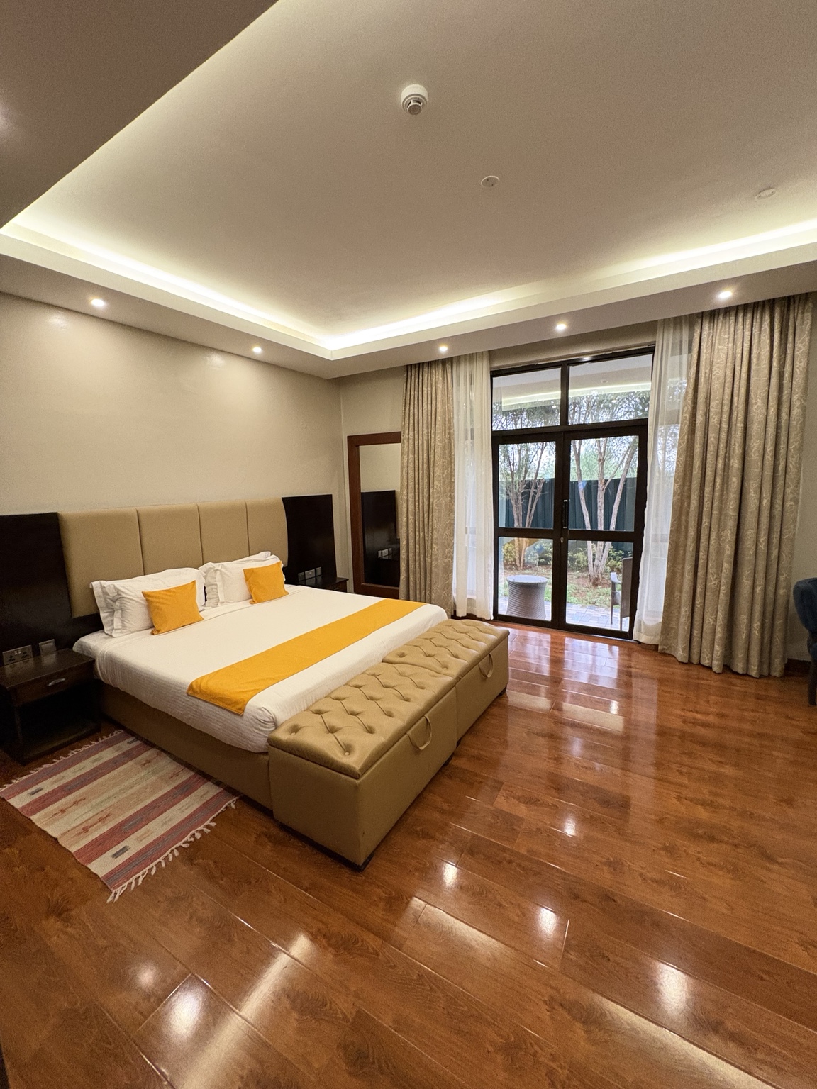 Villa 54 Deluxe Room with solid yellow bed runner